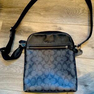 Black and gray Coach Purse.